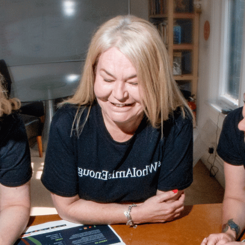 Image shows Nichola Howard from launch north west smiling and looking down at the table