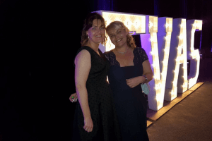 nichola and jo at the 2017 Eva awards stood in from of giant light up letters spelling 'evas'