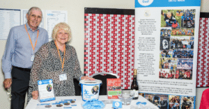 Norman and Ann Kendrick pictured with Joseph’s Goal at Leigh Business Expo in 2018
